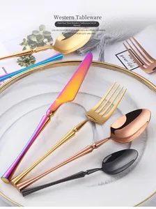 Polished stainless steel cutlery set detail in gold, black, and rose gold finishes
