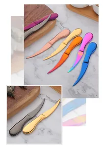 Close-up of multicolor stainless steel shrimp deveiners with serrated blades on marble