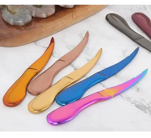 Macro view of multi-color stainless steel shrimp deveiner tools with curved serrated blades