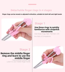 Detalle de los palillos de aprendizaje rosas ajustables en 4 etapas para niños con anillos