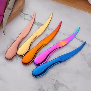 Five-piece colorful stainless steel butter knife set on marble tabletop with wooden board