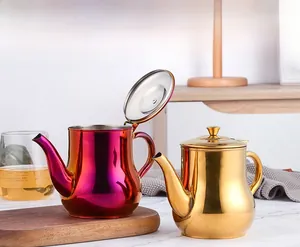 Polished rainbow and gold stainless steel oil dispensers with long spouts and ergonomic handles
