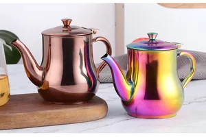 Detailed view of 500ml stainless steel oil dispensers in rose gold and rainbow finishes