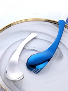 Macro shot of mirror-polished stainless steel spoon with unique curved handle design