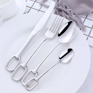 Detail of 304 stainless steel cutlery set with silver mirror finish and bit ring handle