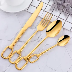 Detailed close-up of 304 stainless steel golden cutlery set with elegant ring handle design