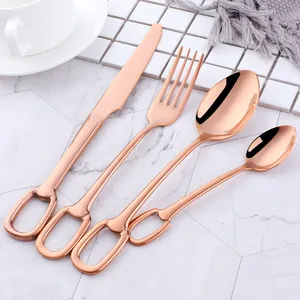 Detail of rose gold 304 stainless steel cutlery set with unique stirrup handle design