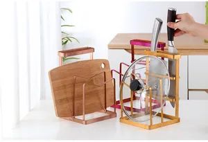 Multi-slot stainless steel knife rack and cutting board organizer in metallic finishes