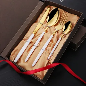 Luxury 4-piece gold and white cutlery set in premium brown gift box with satin lining