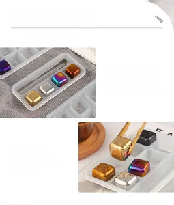 Detail of 304 stainless steel whiskey stones with colored titanium finish and ice tongs