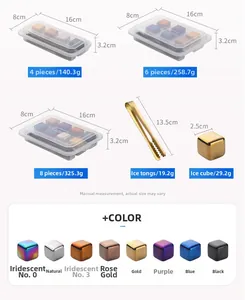 Macro view of 2.5cm colorful stainless steel ice cubes with tongs and storage box