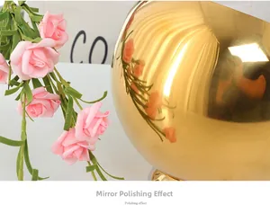 Detail shot of the gold spherical spice jar showing high-gloss mirror polishing effect