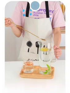 Detailed view of golden spiral handle bar spoon stirring lemon water in a glass pitcher
