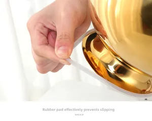 Macro view of golden steel base with white non-slip rubber gasket for stability