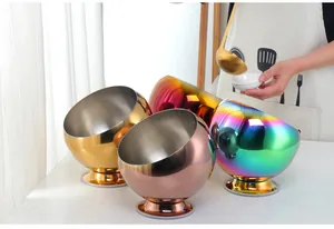 Detail of colorful stainless steel seasoning bowls with slanted opening and stable base