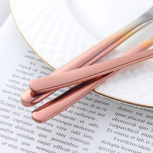 Detailed close-up of rose gold stainless steel cutlery handles with sleek flat design