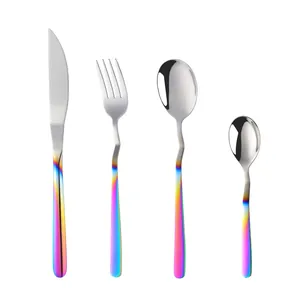 Macro detail of rainbow gradient handles on a polished stainless steel flatware set