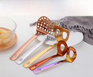 Detail of stainless steel potato mashers in five metallic finishes and functional hole designs