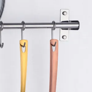 Polished stainless steel kitchen utensils in gold and rose gold with hanging holes