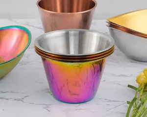 Close-up of rainbow stainless steel sauce bowls showing stacked design and brushed texture