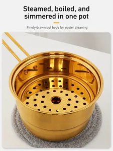 Detail view of golden stainless steel milk pot with steamer insert for versatile cooking