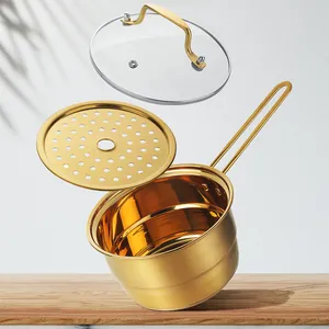 Golden stainless steel milk pot set with steamer tray and glass lid in explosive view
