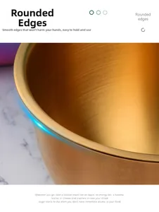 Detail of golden stainless steel mixing bowl with brushed finish and smooth rounded edges