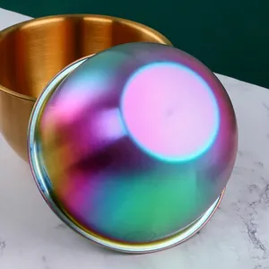 Golden and rainbow 304 stainless steel mixing bowls with scale on marble surface