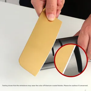 Close-up showing the manual knife sharpener effect on a golden titanium-plated kitchen blade