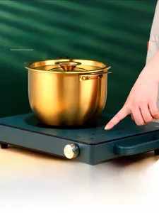 Close-up of deep 304 stainless steel pot with lid on induction cooker for oil storage
