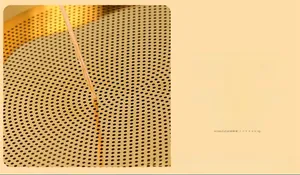 Macro detail of high-density fine mesh gold stainless steel oil strainer with tiny pores