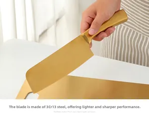 Macro shot of 3Cr13 golden stainless steel chef knife blade being used on a metal board