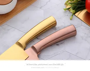 Close-up of ergonomic matte steel knife handles in gold and rose gold finishes