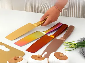 Detail showing colorful stainless steel kitchen knives in gold and rose gold finishes