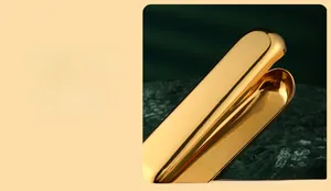 Polished golden stainless steel extended handle for effortless citrus squeezing