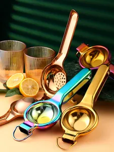Polished stainless steel lemon squeezers in multiple metallic finishes on a kitchen counter