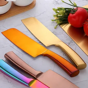Stainless steel chef knife set in multi-color finishes on marble background