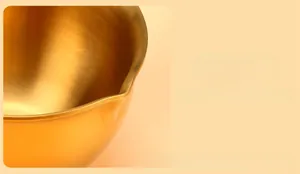 Close-up of golden stainless steel pot featuring functional dual-pour spout design