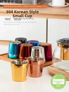 Close-up of double-walled 304 stainless steel cups in various colorful metallic finishes