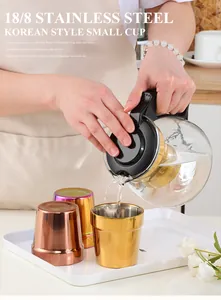 Macro shot of pouring liquid into a double-layer 304 stainless steel gold cup