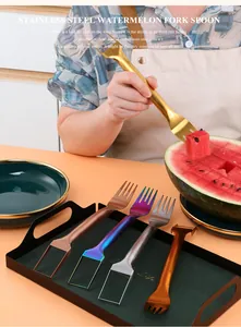Close-up of a stainless steel 2-in-1 watermelon cutter fork tool used for slicing fruit