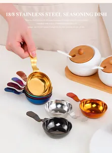 Macro view of a gold stainless steel sauce dish with handle and engraved 304 material mark