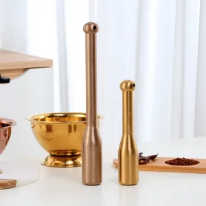 Polished stainless steel mortar and pestle set for kitchen grinding in gold and copper