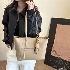 Elegant beige tote bag for women with silk scarf detail and slim shoulder straps