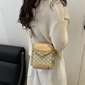 Fashion contrast crossbody square bag with M-letter pattern and gold heart charm