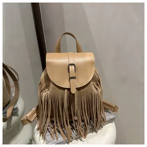 Close-up of bohemian tassel backpack featuring premium PU leather and metal buckle detail