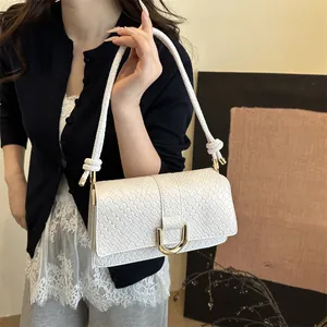 Elegant white woven square handbag with gold horseshoe buckle and rope shoulder strap