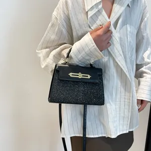 Black sequin and leather crossbody bag for women with elegant gold twist lock clasp