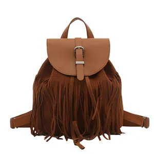 Caramel brown fringe backpack with top handle and buckle flap in premium suede texture