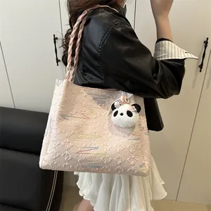 Pink tote bag with wave embroidery, woven straps and a cute panda plush charm